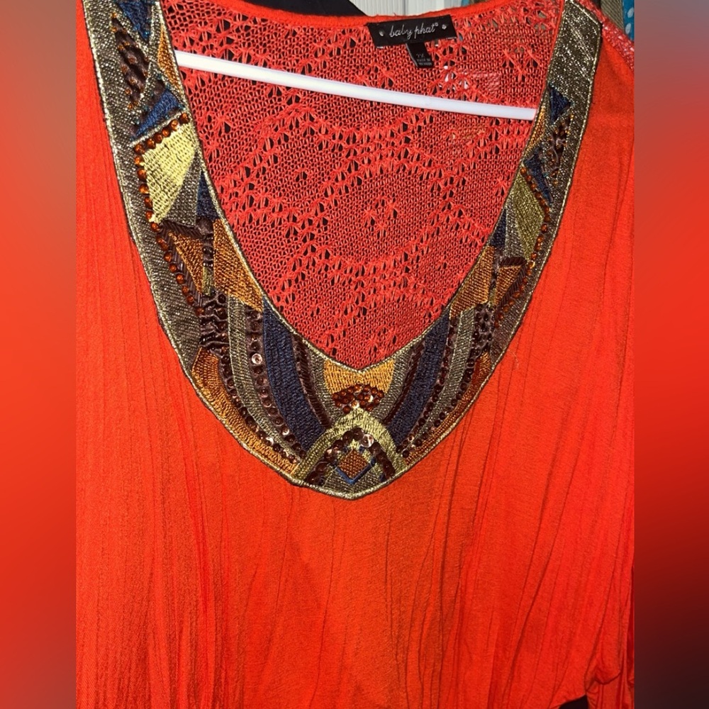 Bright orange batwing top with crochet back! So stylish
